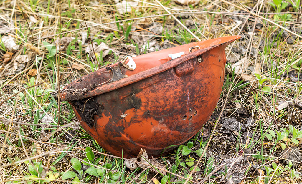 A dirty and expired hard hat.