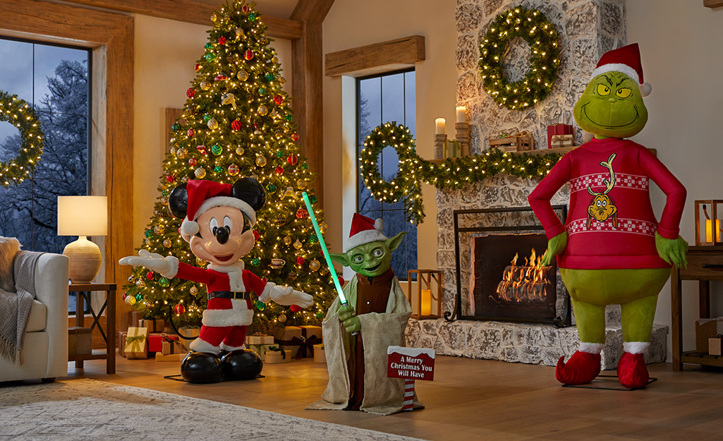 Popular animatronic characters stand in a holiday decorated living area.