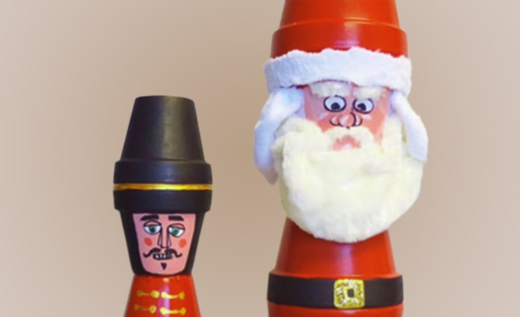 Terra cotta pots glued and painted like Santa and a tin soldier.