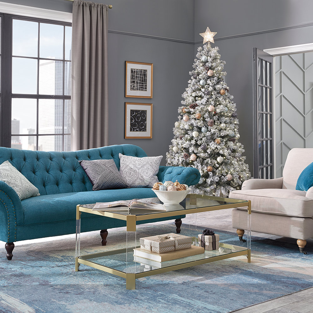 A city apartment living room with a decorated Christmas tree. A city apartment living room with a decorated Christmas tree.