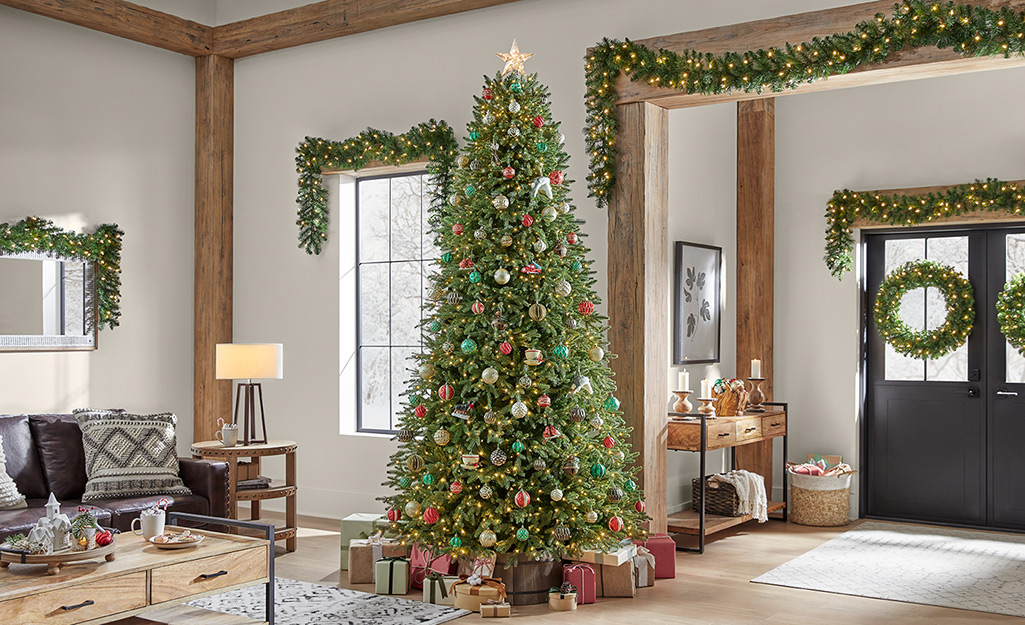A decorated Christmas tree in a rustic living room.