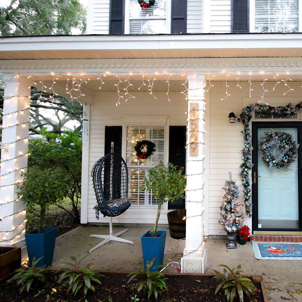 A holiday porch decorated with icicle lights. A holiday porch decorated with icicle lights.