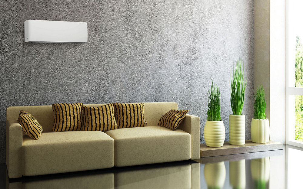 A living room featuring a ductless mini split air conditioner on the wall.