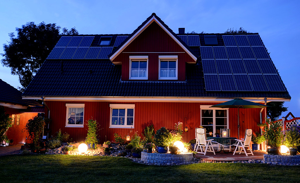 Solar panels on a home at night.
