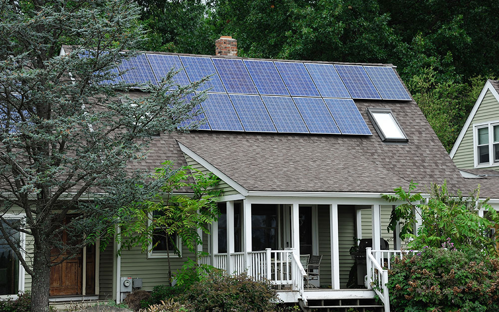 A house with solar panels installed on the roof.