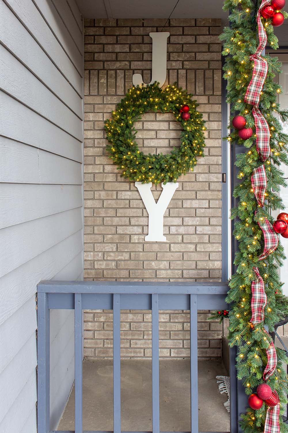 Christmas reef and garland on front porch