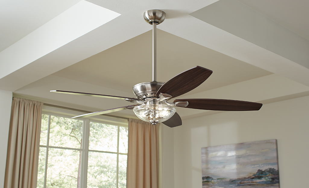 A ceiling fan with a light fixture.