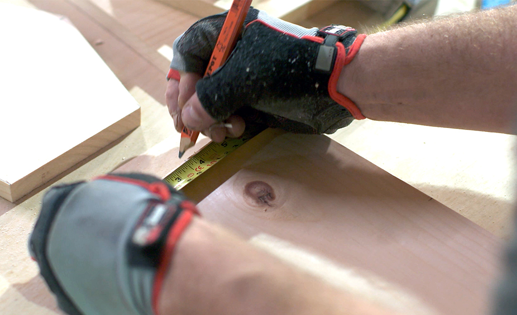 A piece of wood being measured and marked.