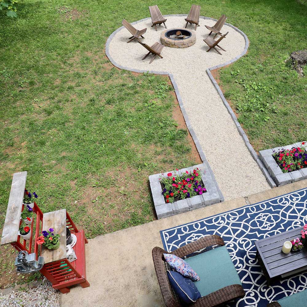 Fire pit with cinder block benches and stone surrounding.