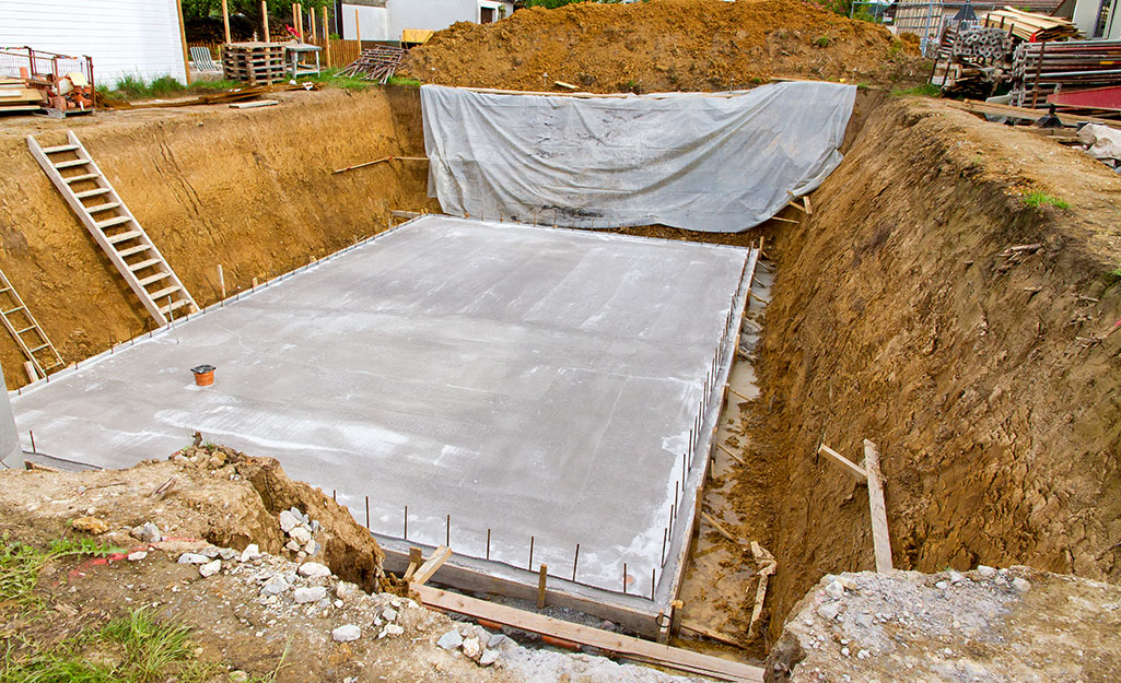 The concrete slab for a basement foundation.