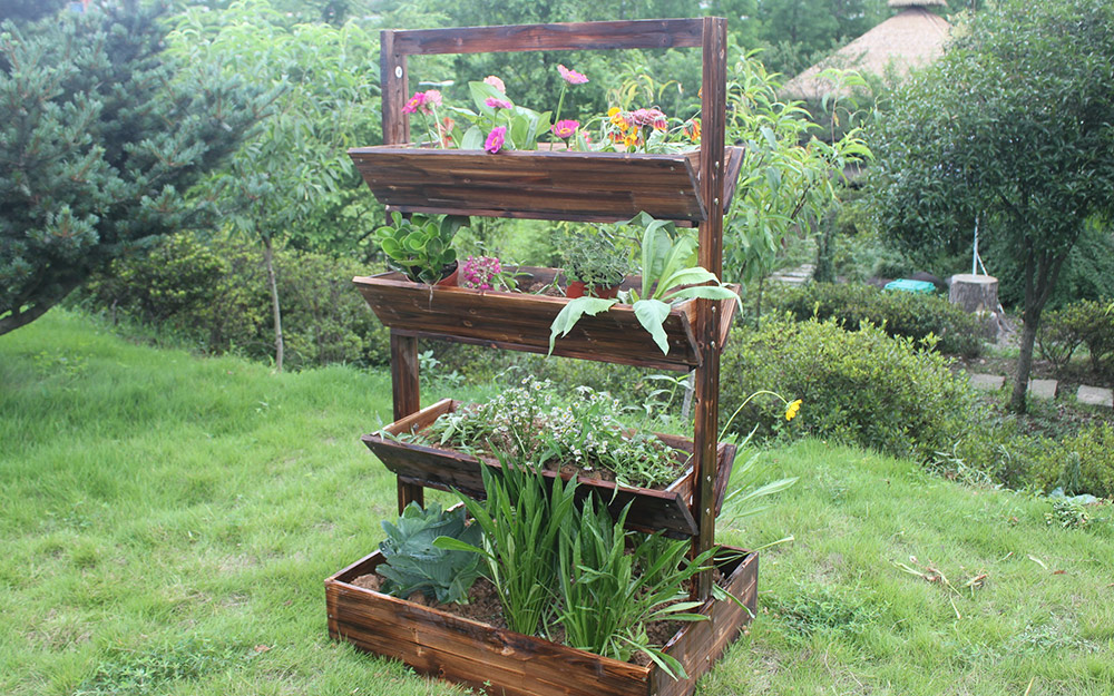 A group of plants in a vertical garden planter