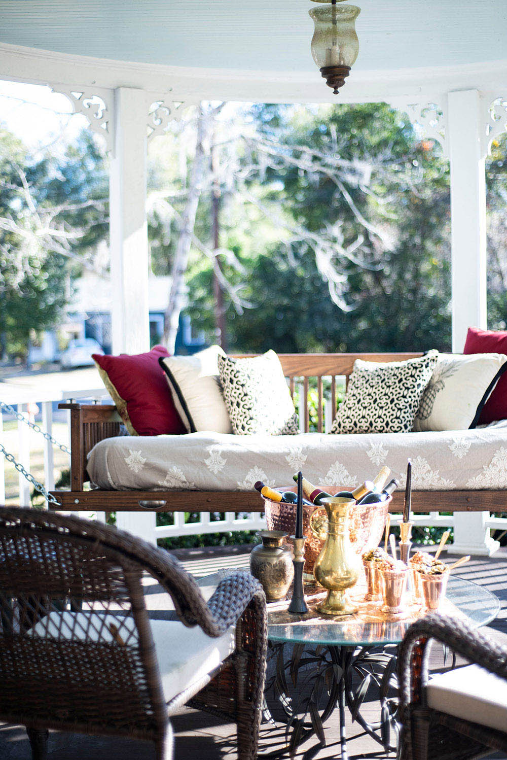 Front porch with side chairs and swing