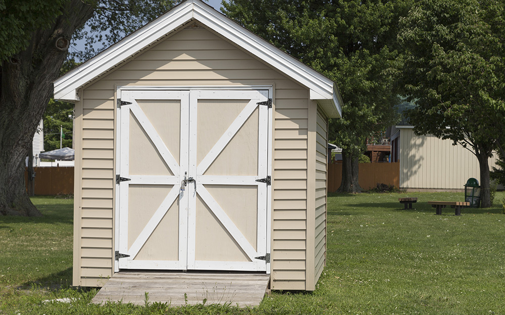A shed with a ramp at its door.