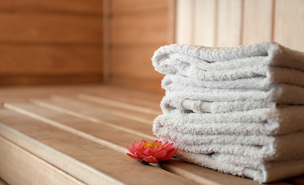 Towels stacked in a sauna.