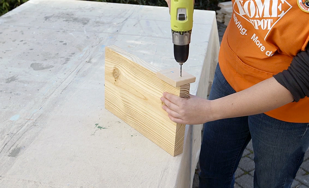DIY-er making a wood support brace.