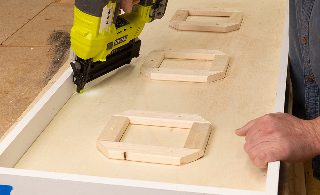 Attach the plywood to the inner supports with 18 gauge brad nails.