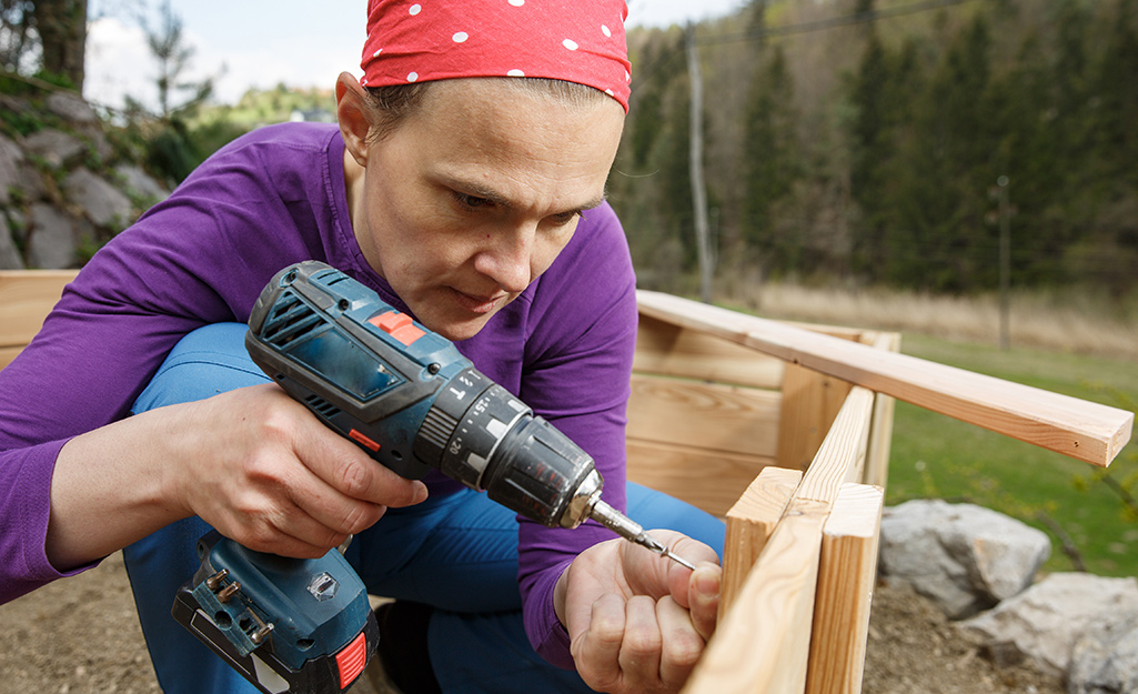 DIY-er uses drill to join boards