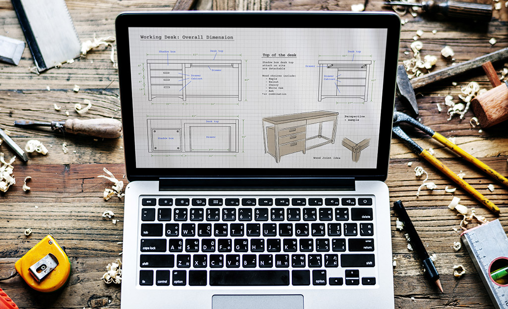 A laptop featuring a woodworking design.
