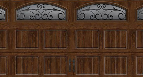 A wooden garage door with windows. A wooden garage door with windows.