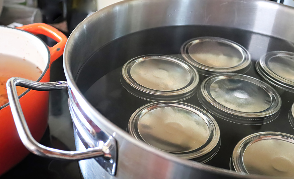 A pot of water containing food items to be preserved. A pot of water containing food items to be preserved.
