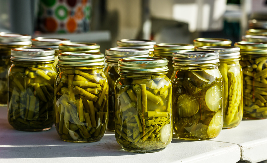 A variety of pickled foods in jars. A variety of pickled foods in jars.