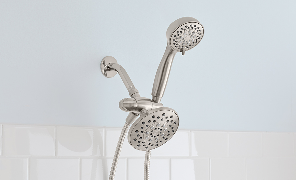 A combo mount shower head in a shower.