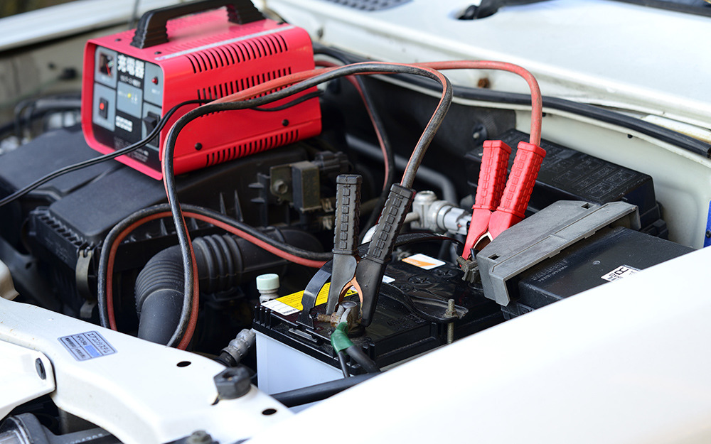 a car battery charger connected to a car battery