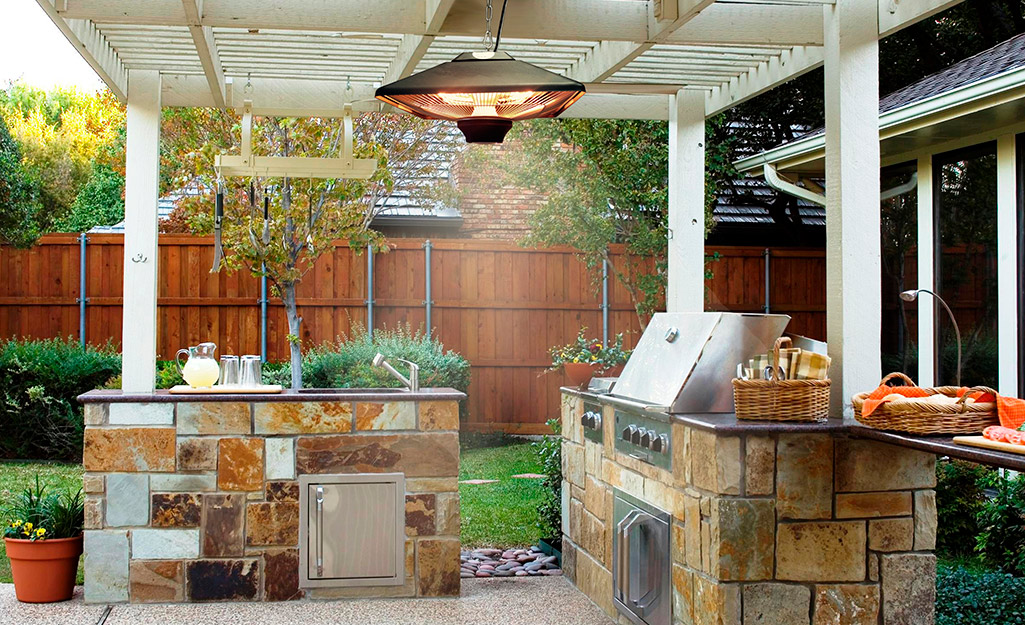 Overhead electric patio heater in an outdoor kitchen