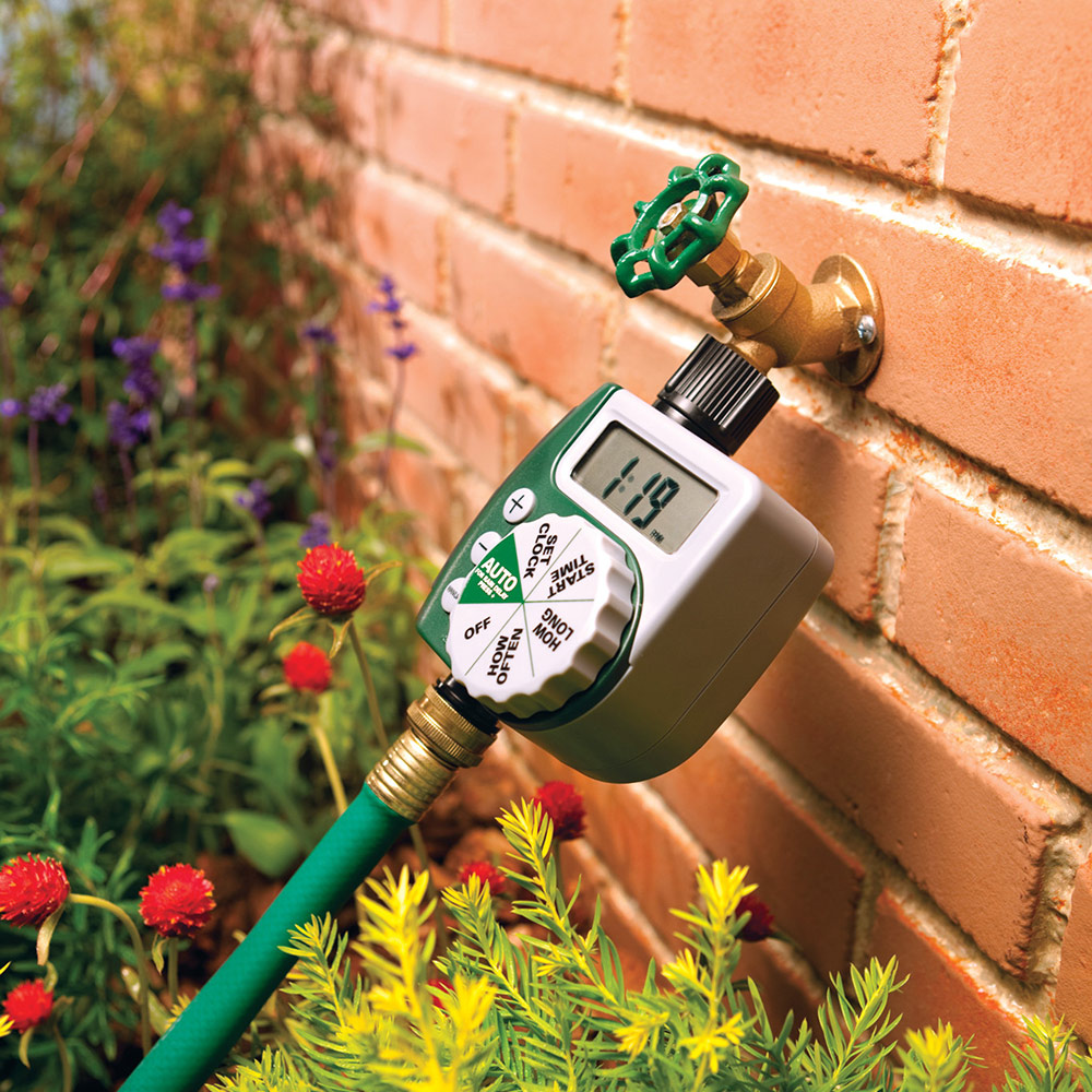 An irrigation timer connected to a hose.