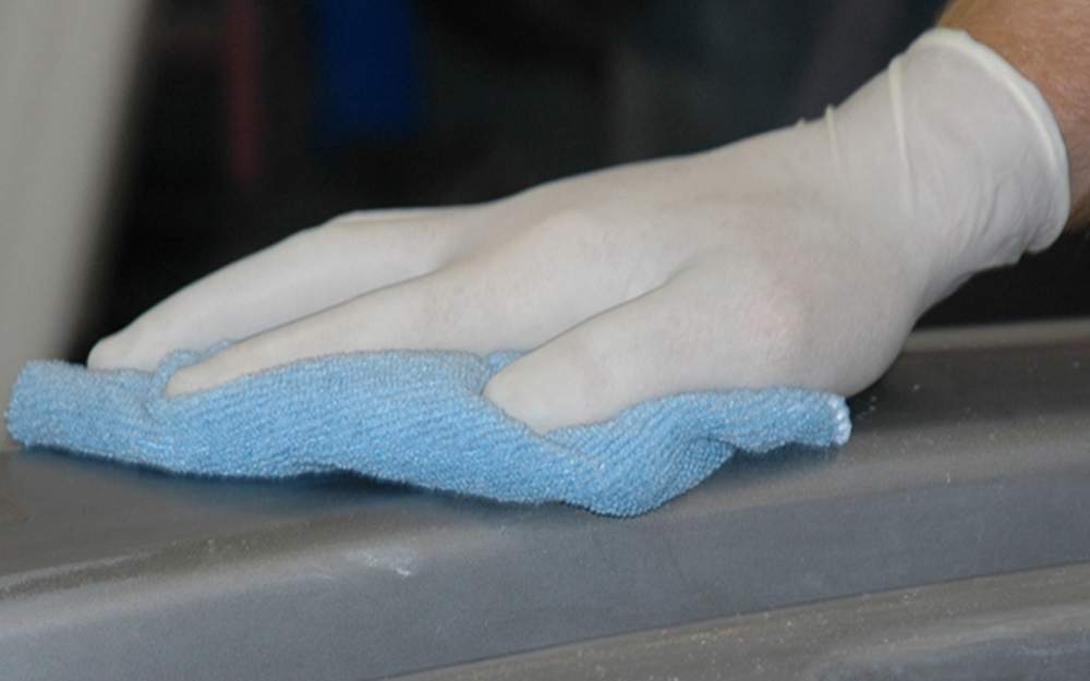 a thin glove being used in cleaning