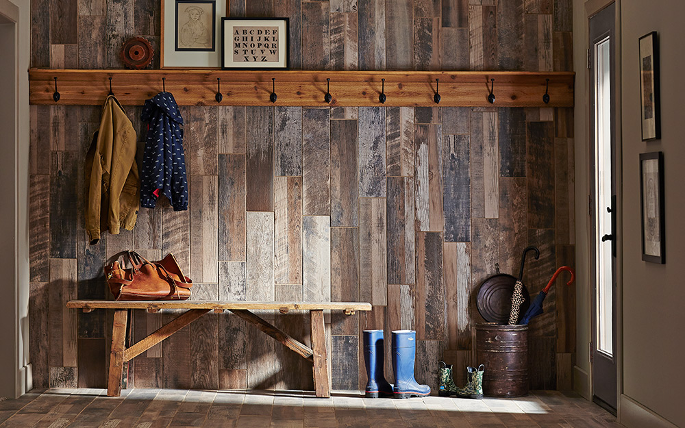 Appearance boards covering a wall in a mudoom.