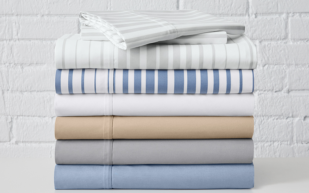 A stack of lighter colored sheets for warmer months. 