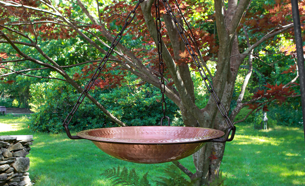 A hanging birdbath made of copper. A hanging birdbath made of copper.