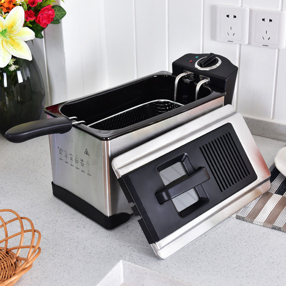 A small deep fryer sits on a kitchen counter.