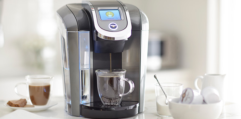 A Keurig machine making coffee.