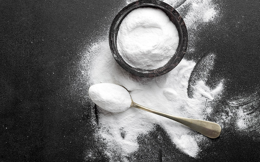 Baking soda on a solid background.