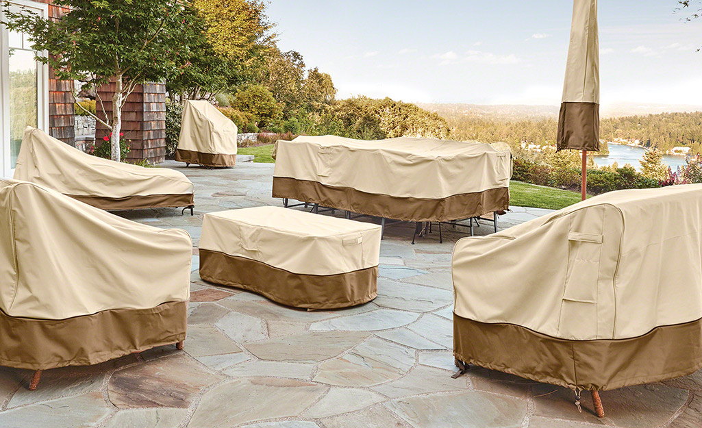 Outdoor furniture covers protecting a patio set.