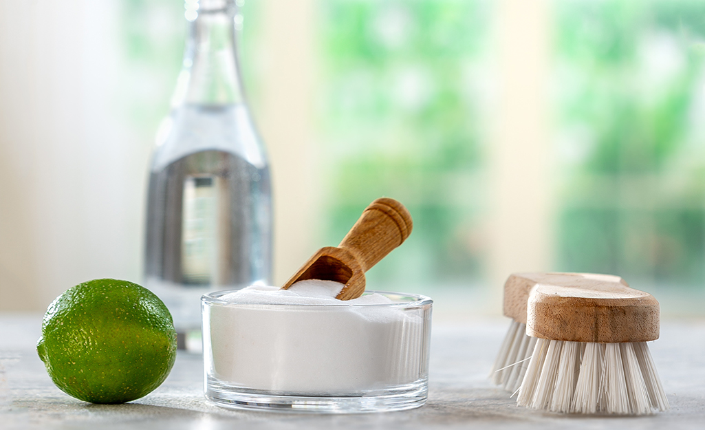 Baking soda and other ingredients placed on a countertop.