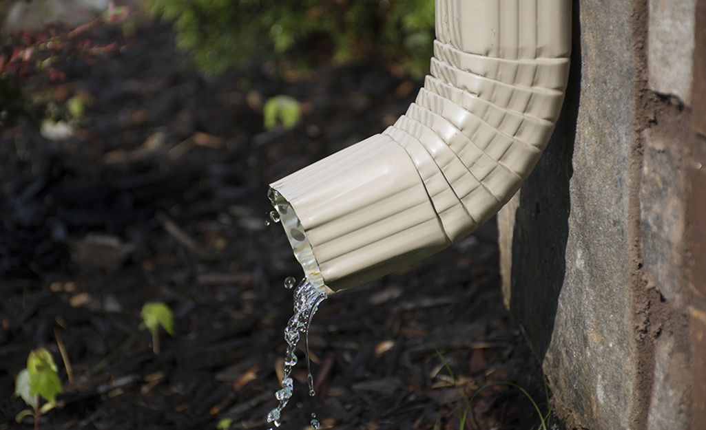 Water draining from a downspout.