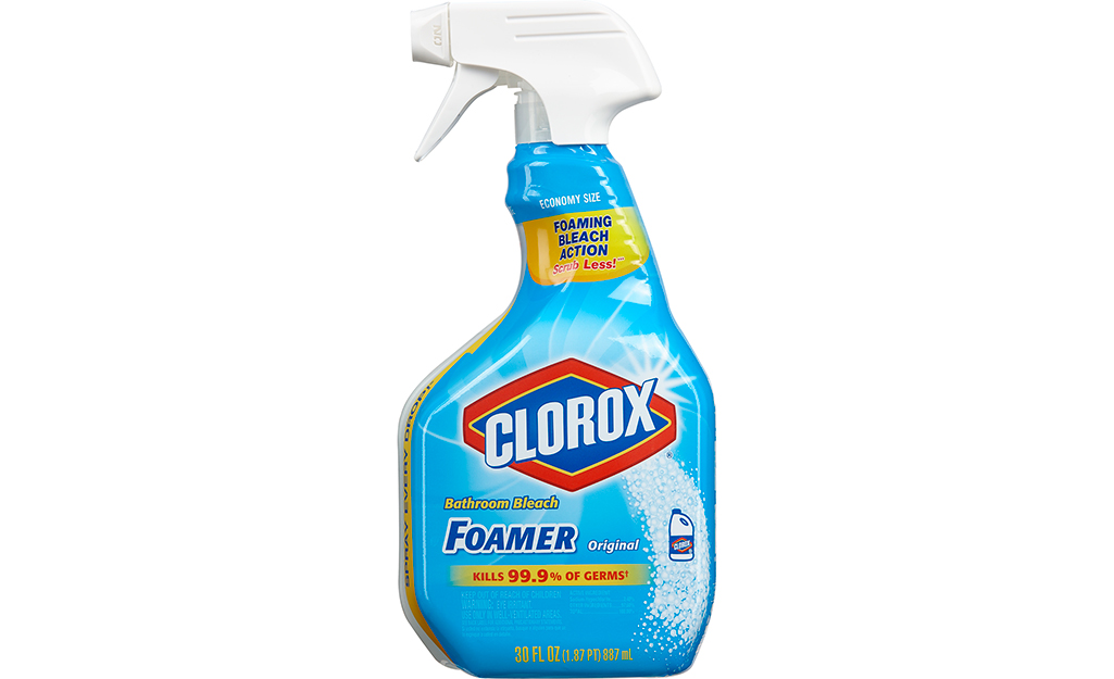 A spray bottle of foaming shower cleaner on a white background