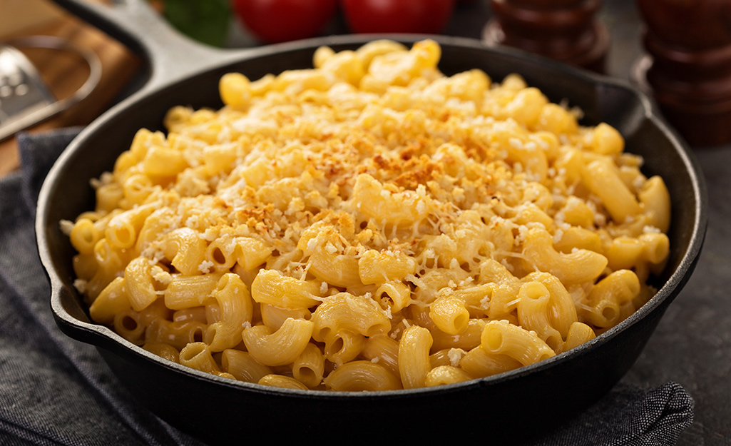 Smoked four-cheese Mac and Cheese in a cast iron skillet.