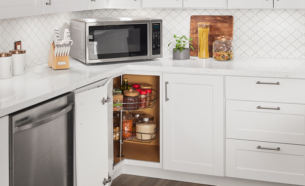 A lower kitchen cabinet featuring a lazy Susan.