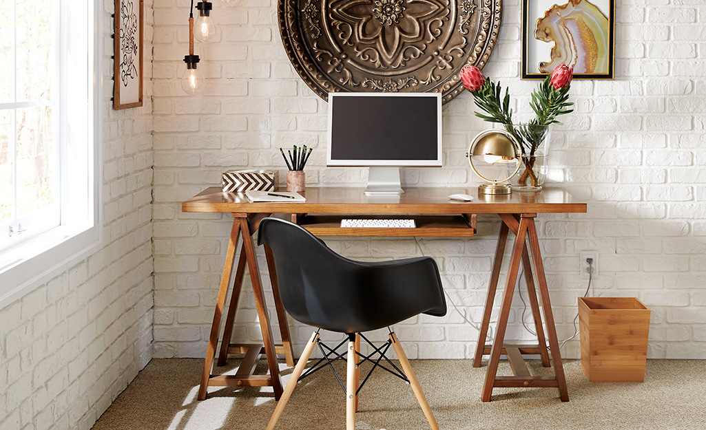 A small home workspace set up in a corner. A small home workspace set up in a corner.