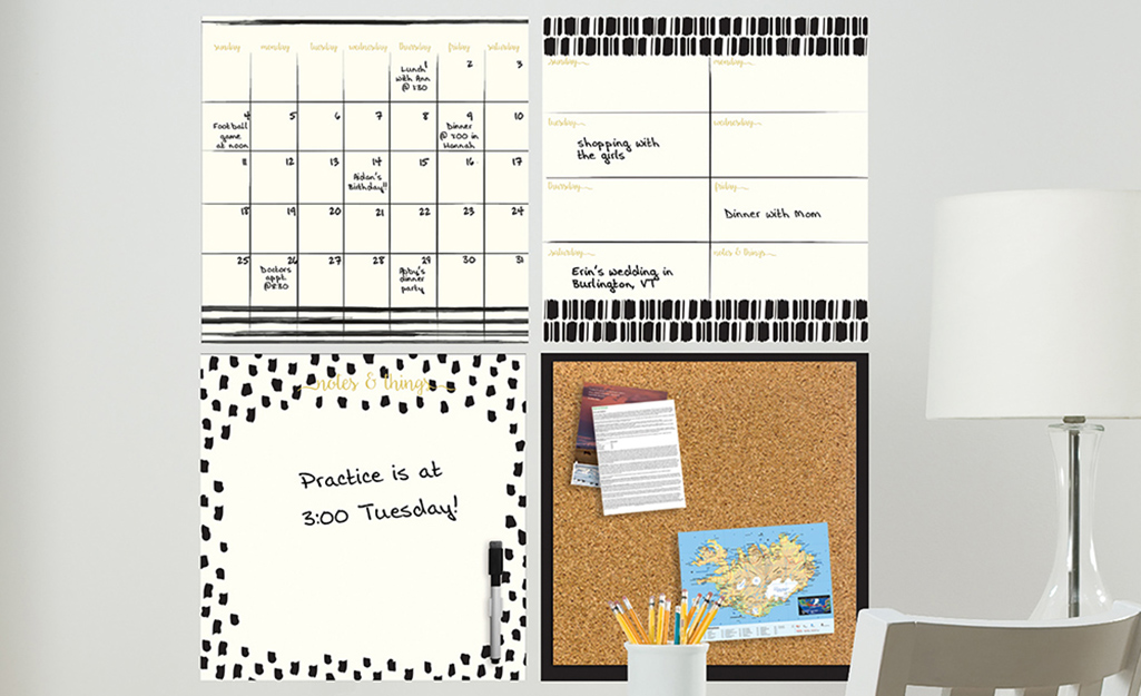 Several large dry erase calendars and note-boards affixed to a wall. Several large dry erase calendars and note-boards affixed to a wall.