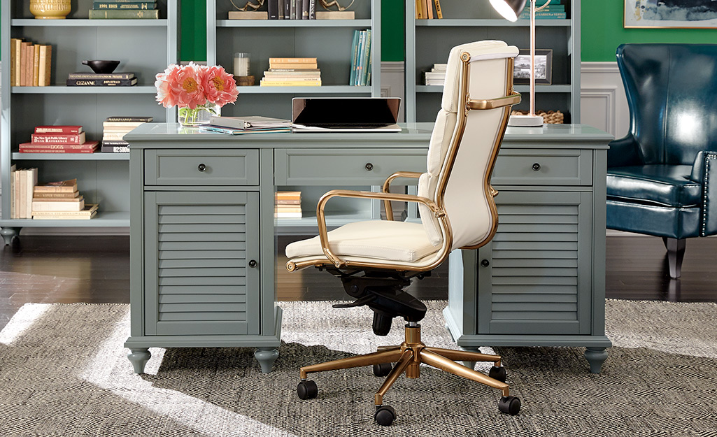 A cushioned desk chair in a home workspace. A cushioned desk chair in a home workspace.
