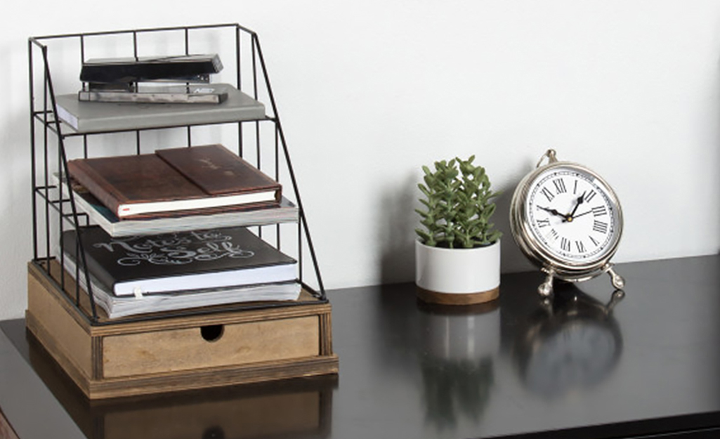 File organizers and desk accessories on a desktop in a home workspace. File organizers and desk accessories on a desktop in a home workspace.