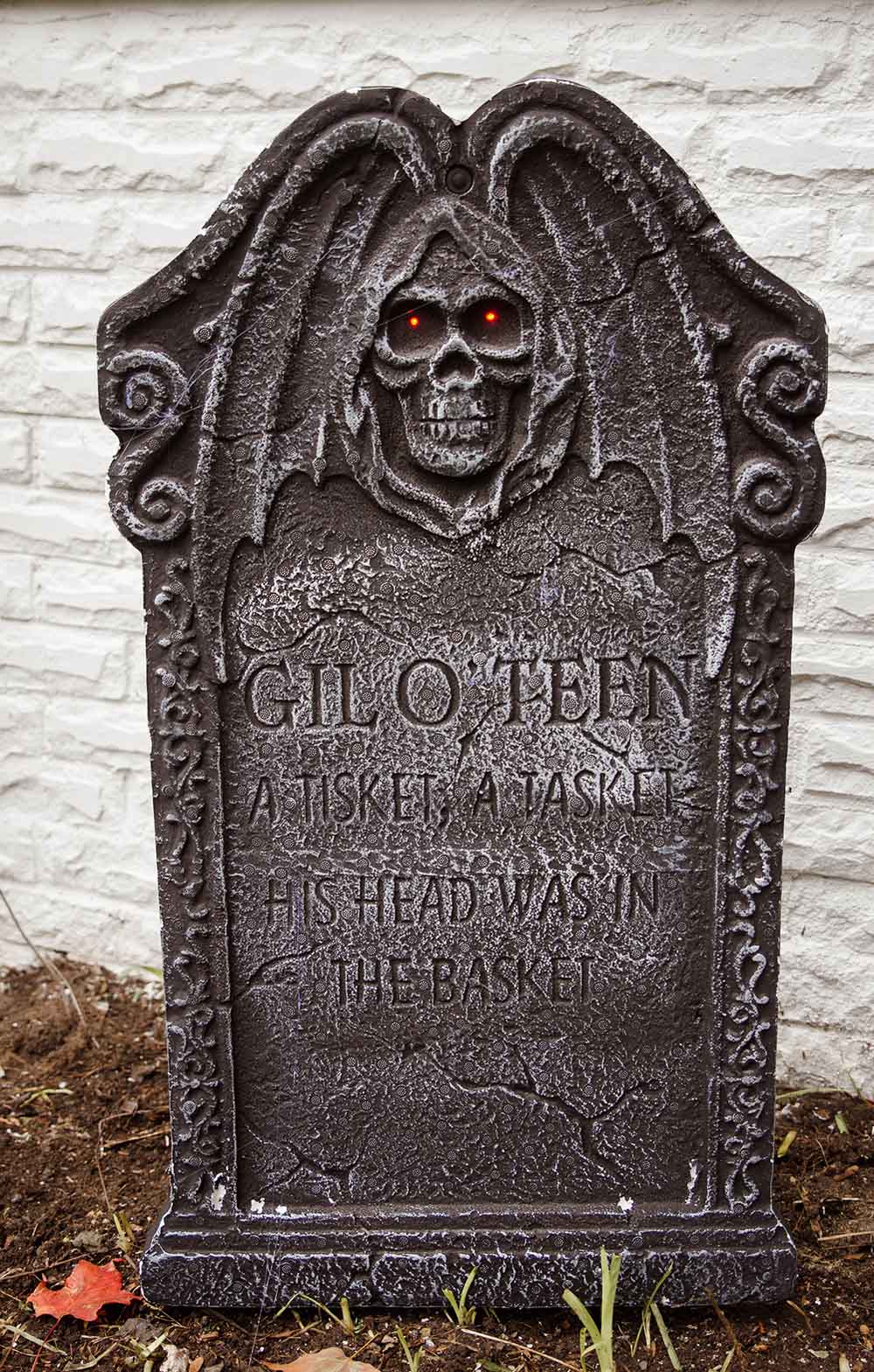 A large tombstone with red eyes.