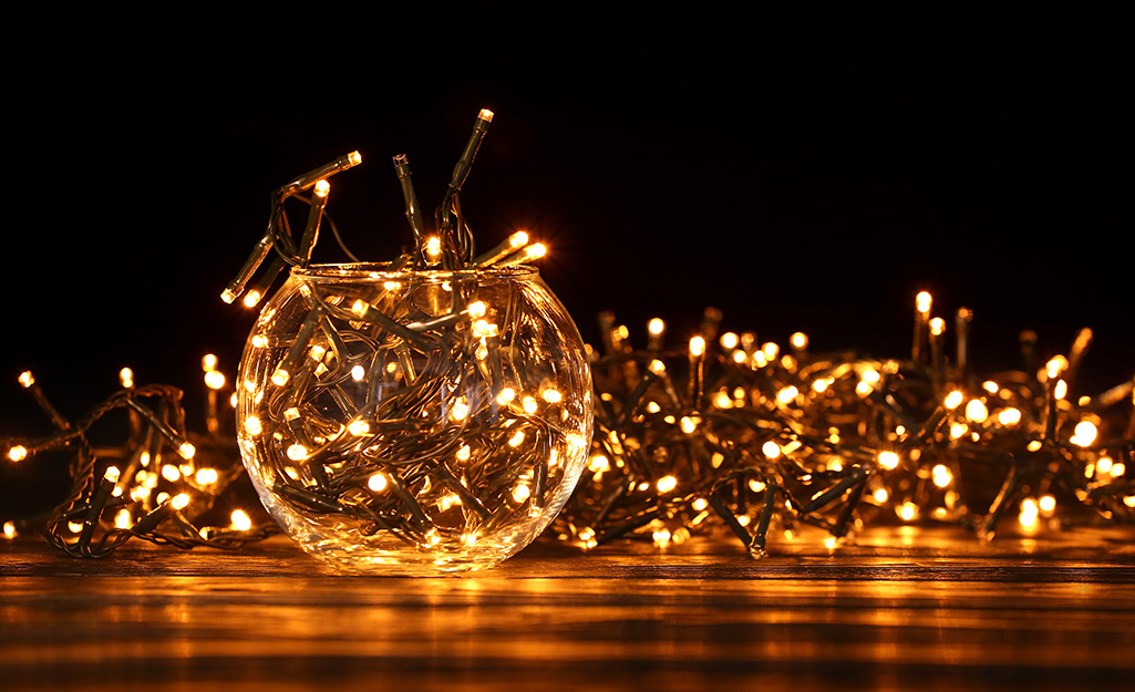 Battery wire Christmas lights illuminating a dark space.