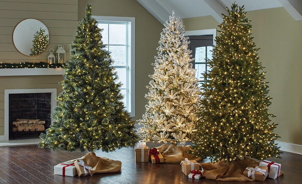 Green and white Christmas trees featuring different types of lights.