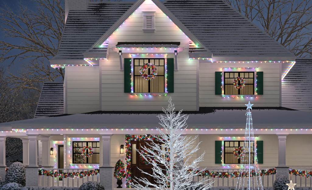 Two-story home decked out with pastel and white Christmas lights.
